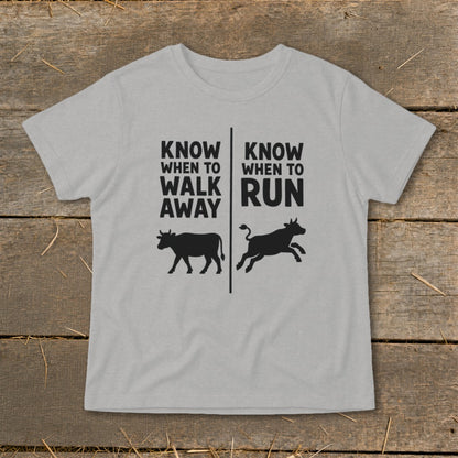 Grey t-shirt with text "Know When to Walk Away" and "Know When to Run" with cow graphics.