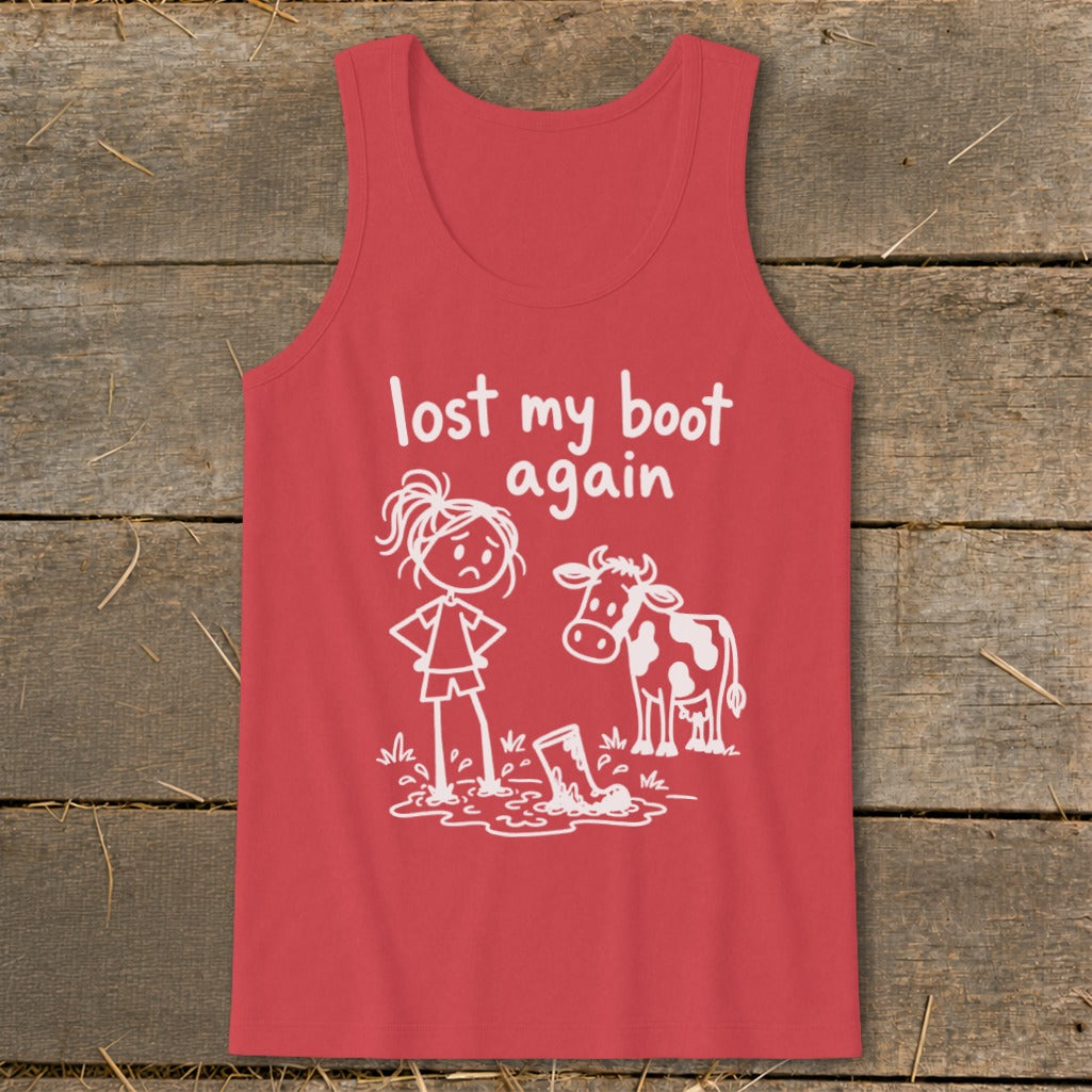 A red tank top features a white graphic of a sad girl, a cow, and a boot in mud, with the text "lost my boot again".