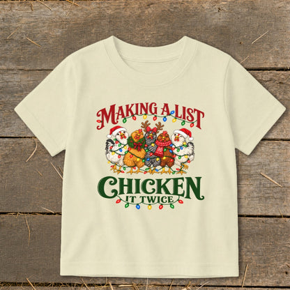 Cream t-shirt with chickens in holiday attire, "Making a list chicken it twice" text.