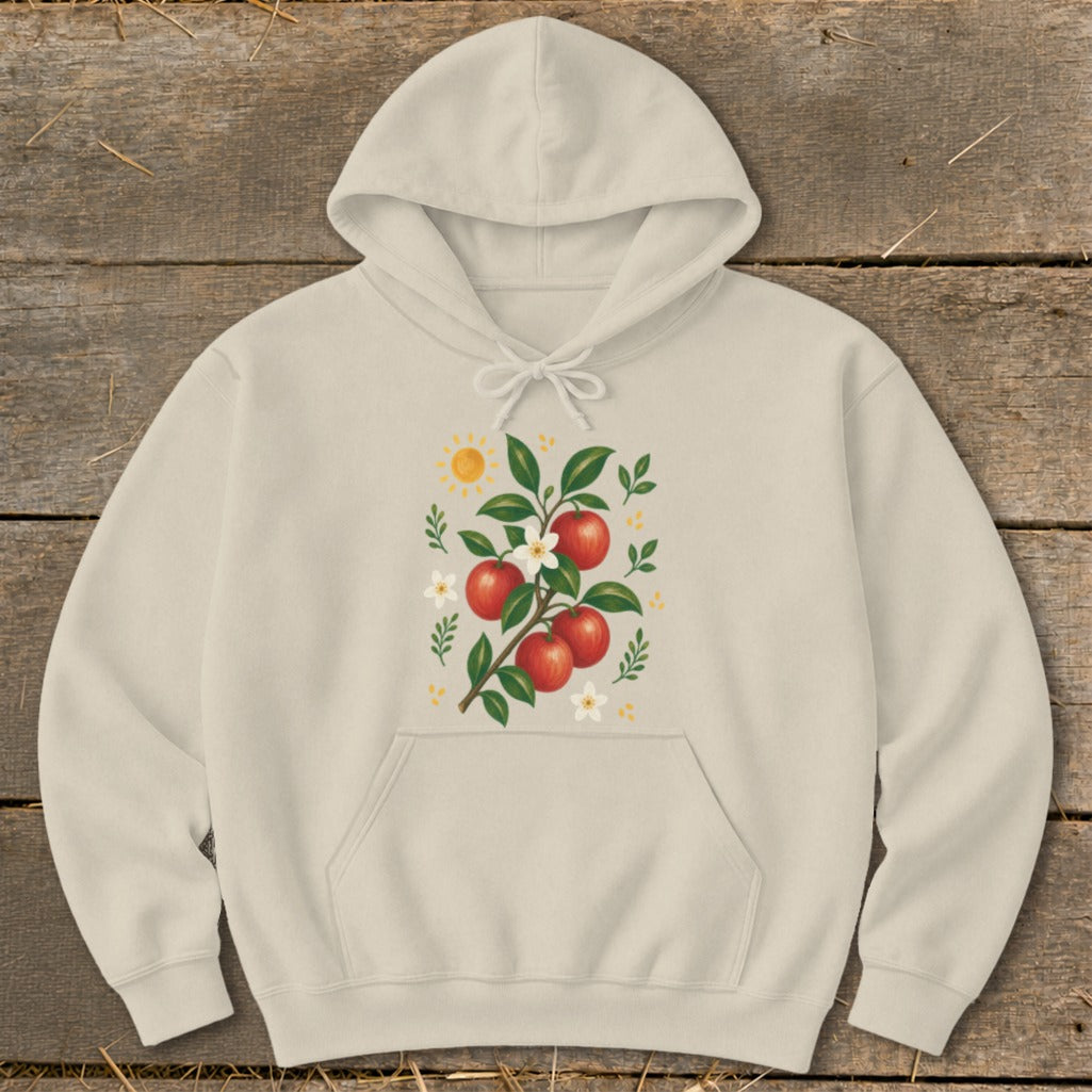 Cream hoodie with illustration of red apples, white flowers, and sun.