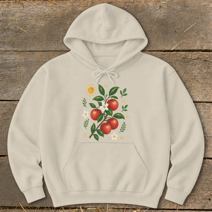 Cream hoodie with illustration of red apples, white flowers, and sun.