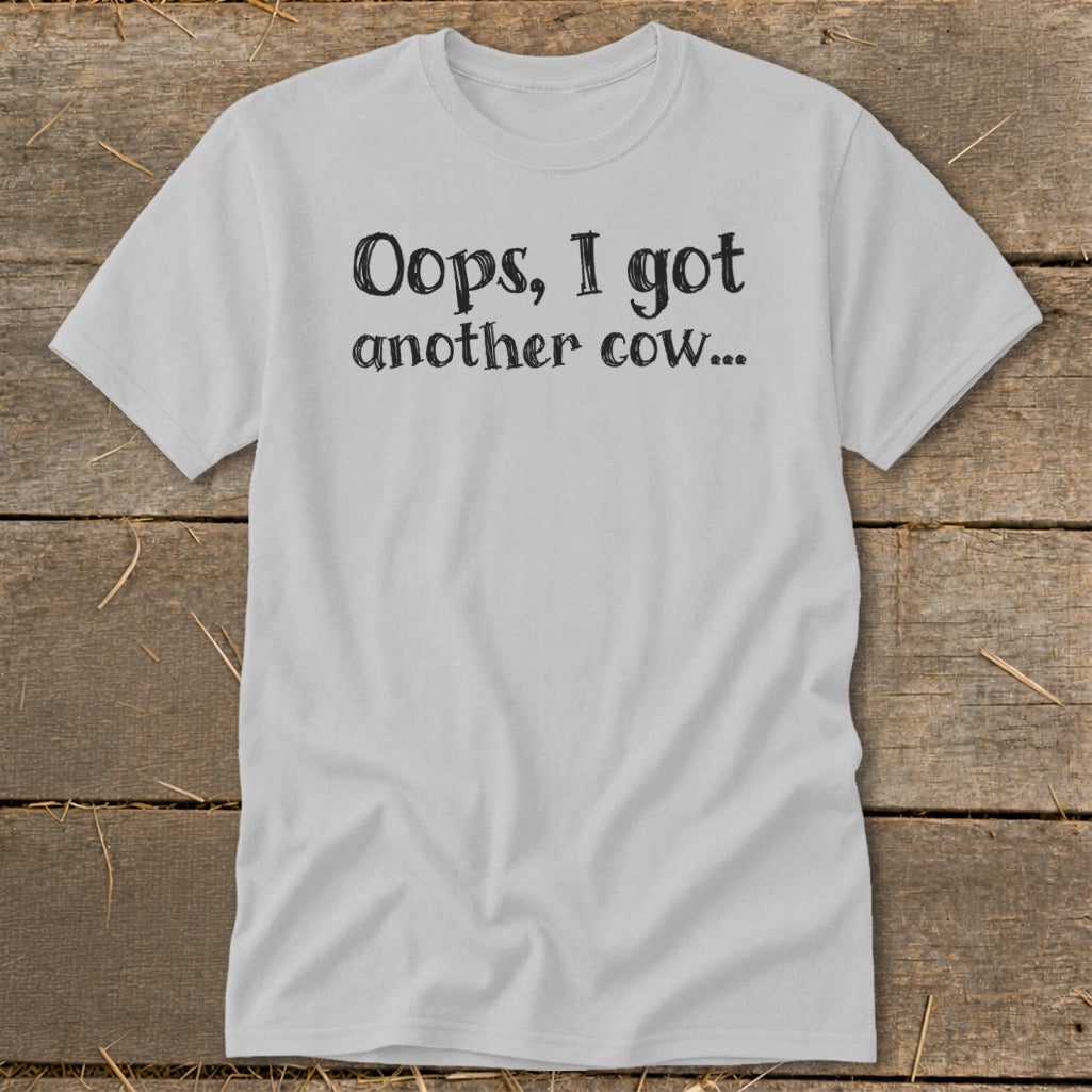 Light grey t-shirt with "Oops, I got another cow..." text.
