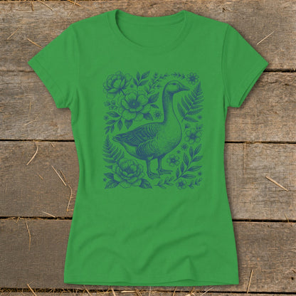 Green t-shirt with a blue goose and floral sketch design on the front.