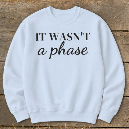 Light blue sweatshirt with black text reading "IT WASN'T a phase".