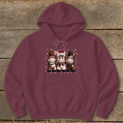 Maroon hoodie with a graphic of three cartoon horses wearing Christmas attire.