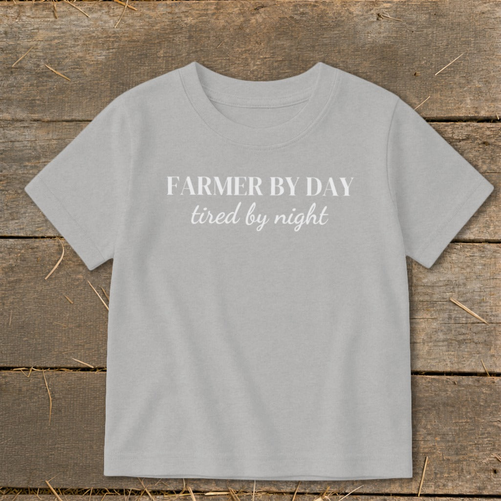 Light grey t-shirt with white text "FARMER BY DAY tired by night".