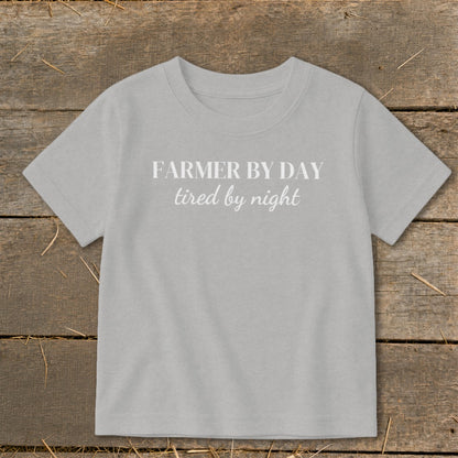 Light grey t-shirt with white text "FARMER BY DAY tired by night".