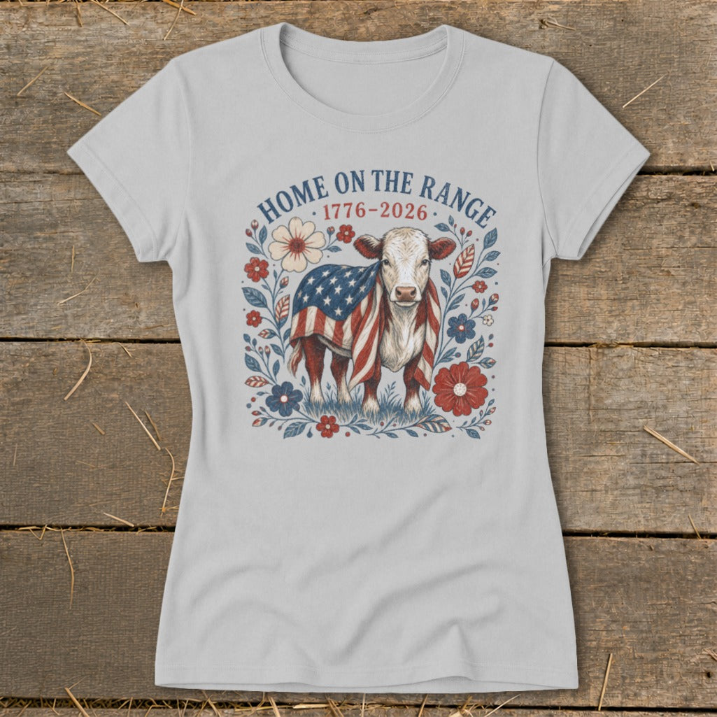 Light gray t-shirt with a cow wearing an American flag, surrounded by flowers and text.