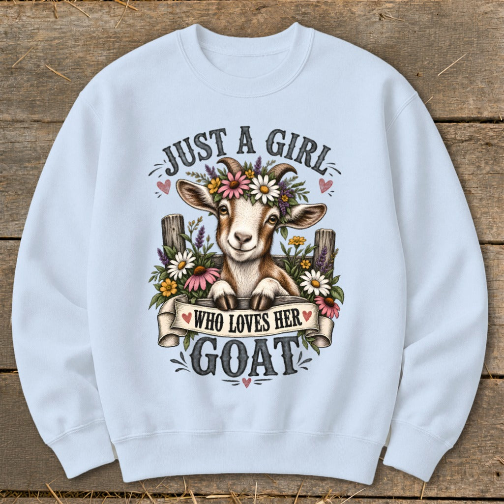 Sweatshirt with a smiling goat wearing a flower crown and the text "Just a girl who loves her goat."