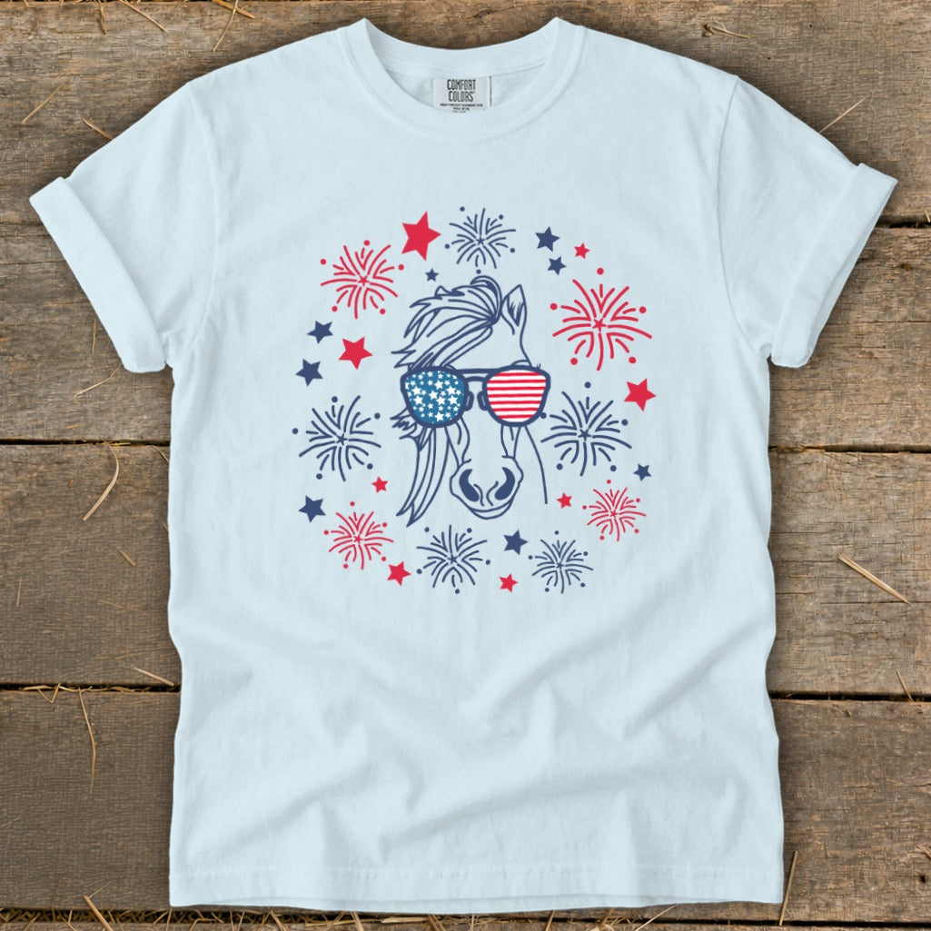 White t-shirt with a horse wearing American flag sunglasses and surrounded by fireworks.