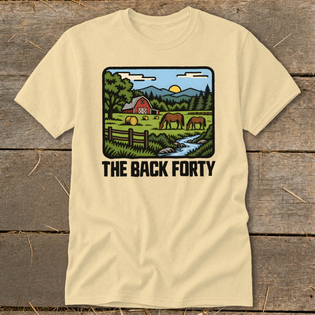 Cream-colored t-shirt with a rural graphic showing horses grazing near a red barn and text reading THE BACK FORTY.