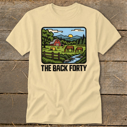 Cream-colored t-shirt with a rural graphic showing horses grazing near a red barn and text reading THE BACK FORTY.