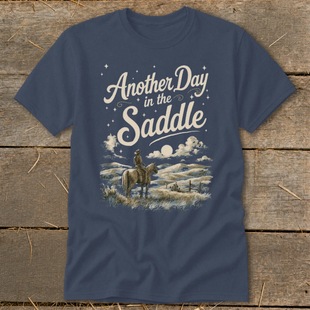 Dark blue t-shirt with "Another Day in the Saddle" text and cowboy on horseback.