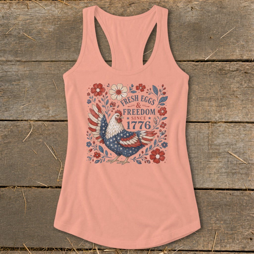 Peach tank top with a patriotic chicken graphic and "Fresh Eggs & Freedom Since 1776" text.