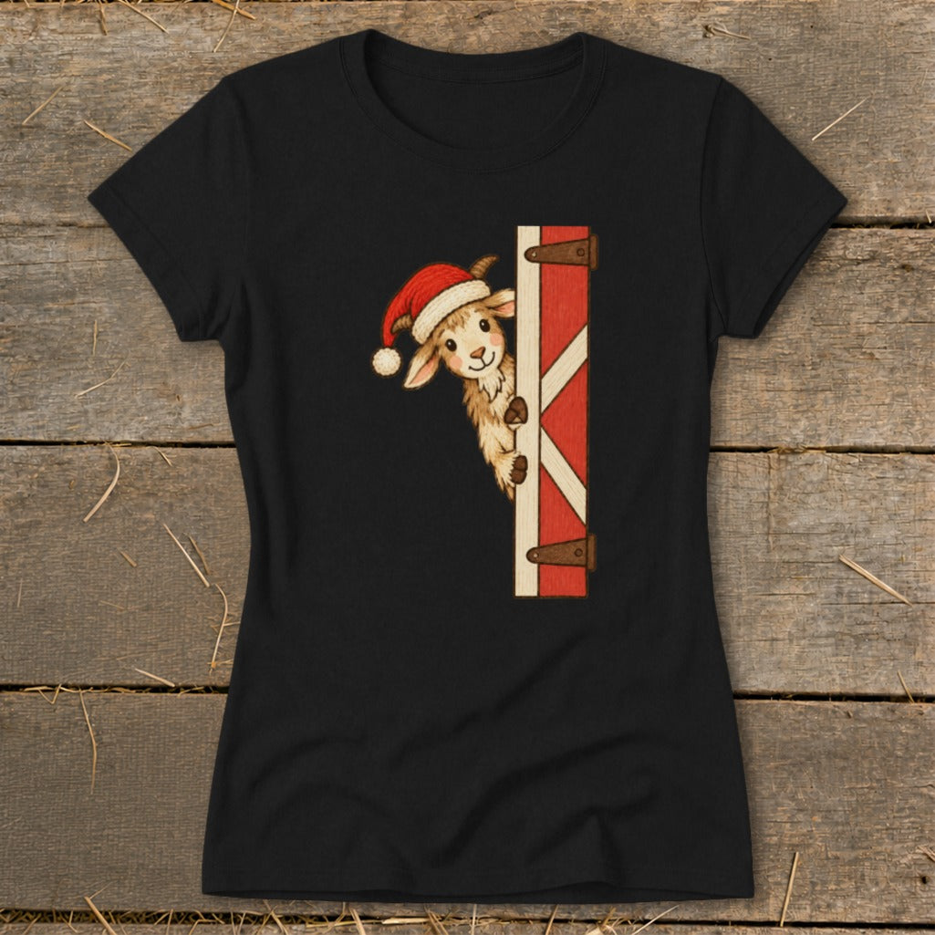 Black t-shirt with a cheerful goat wearing a Santa hat peeking around a barn door.