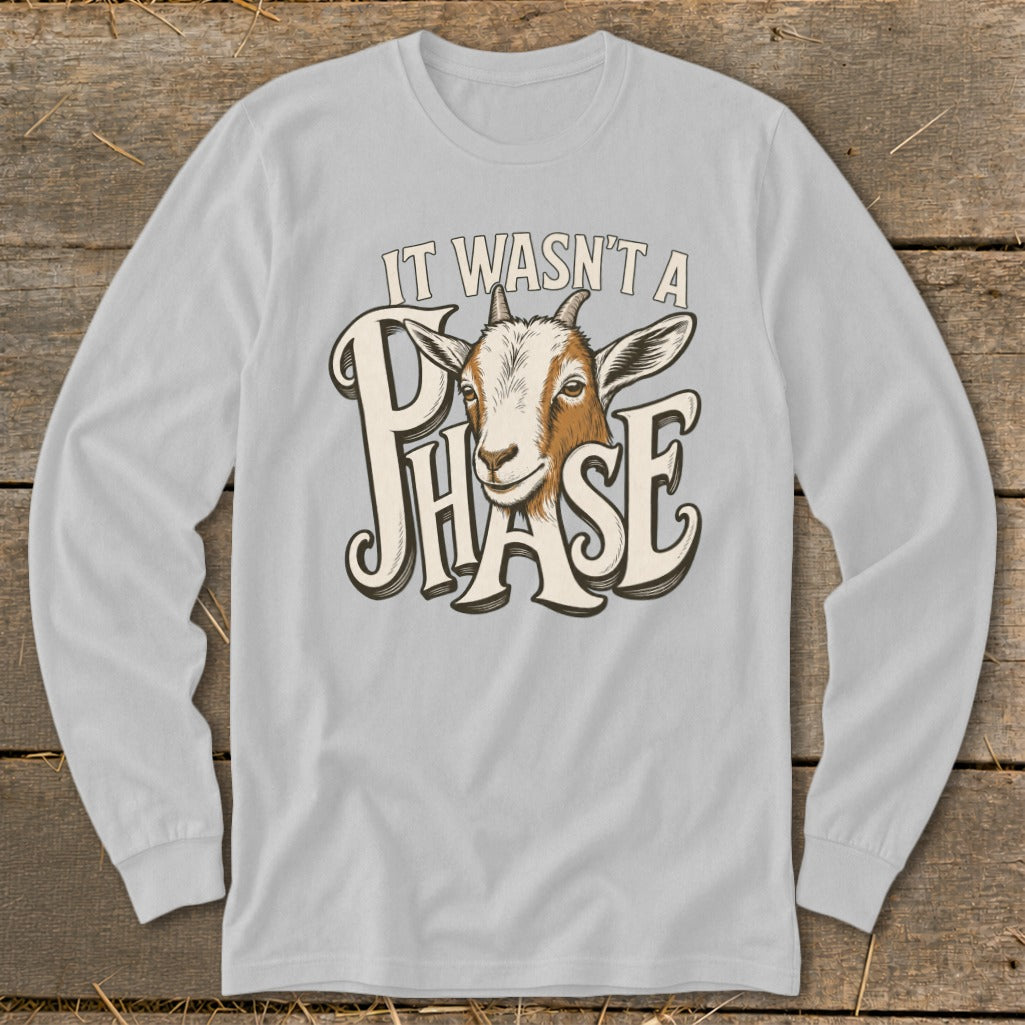 Light gray long-sleeve shirt with goat graphic and text "IT WASN'T A PHASE".