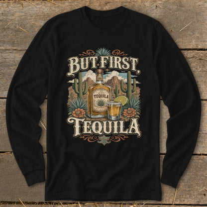 "But First Tequila" text with agave plants, cacti, mountains, tequila bottle, and shot glass.