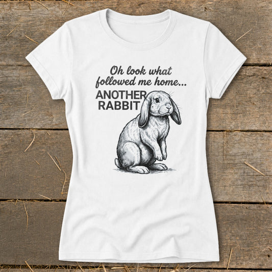 White t-shirt with drawing of a lop-eared rabbit and text "Oh look what followed me home... ANOTHER RABBIT".
