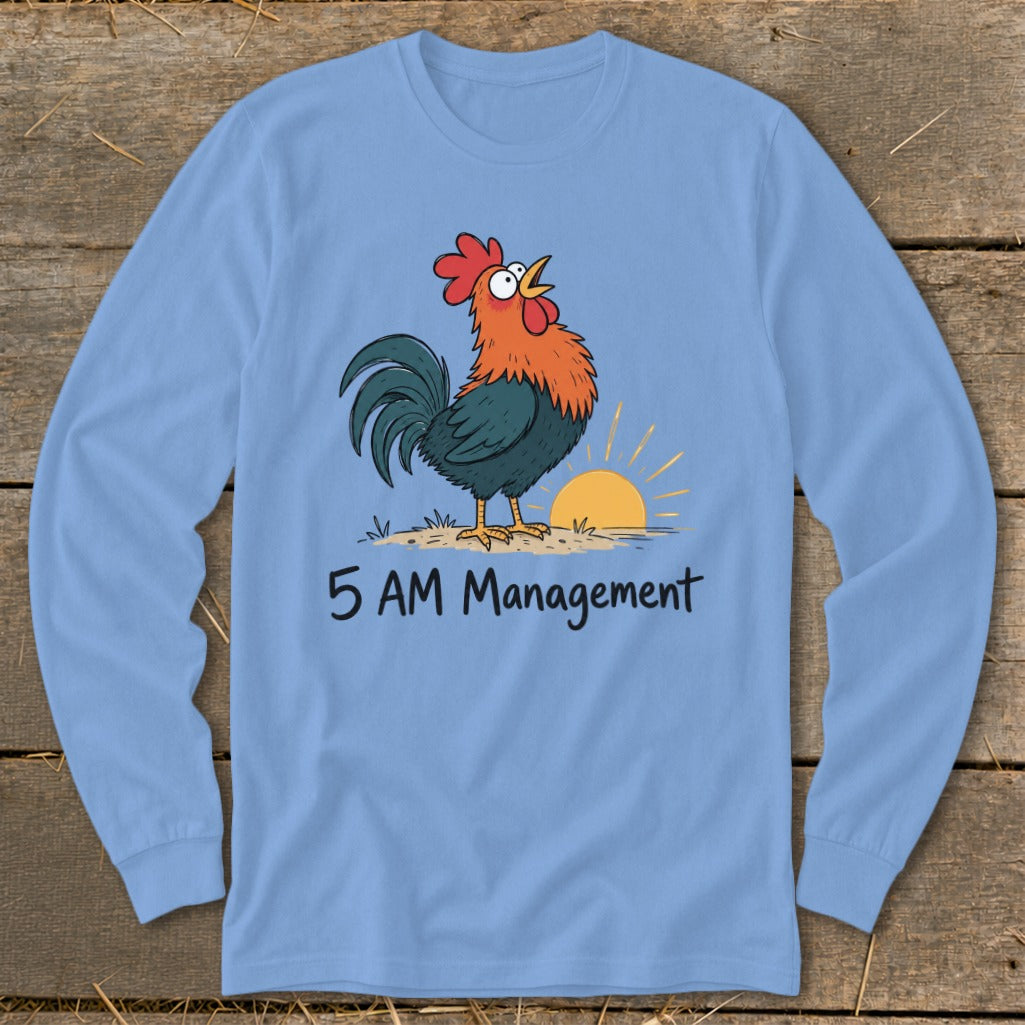 Light blue long sleeve shirt with cartoon rooster crowing at sunrise, text reads "5 AM Management".