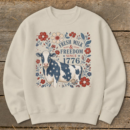 Cream sweatshirt with cow, stars, and text: Fresh Milk & Freedom Since 1776.
