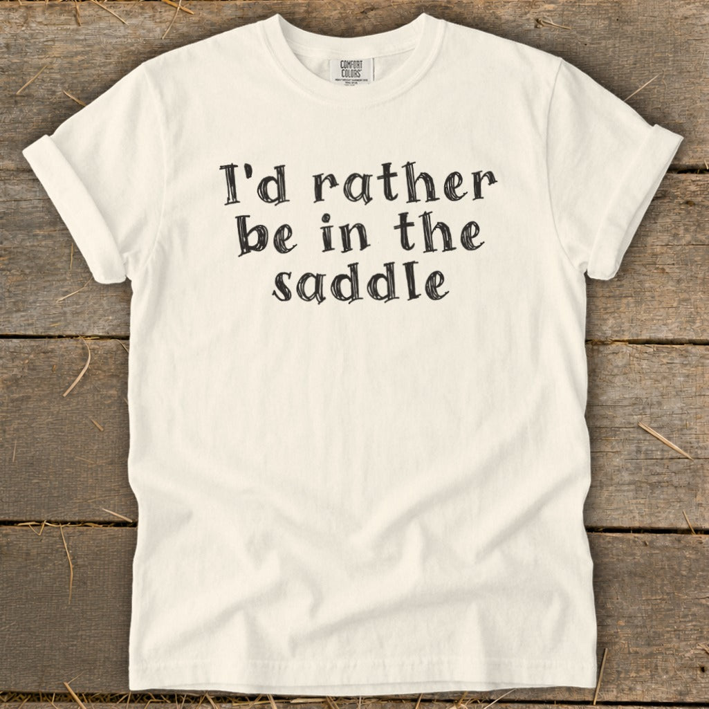 Cream t-shirt with black text that reads "I'd rather be in the saddle".