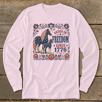 Long-sleeve shirt with American flag-themed horses and "Raised on Freedom Since 1776" text.