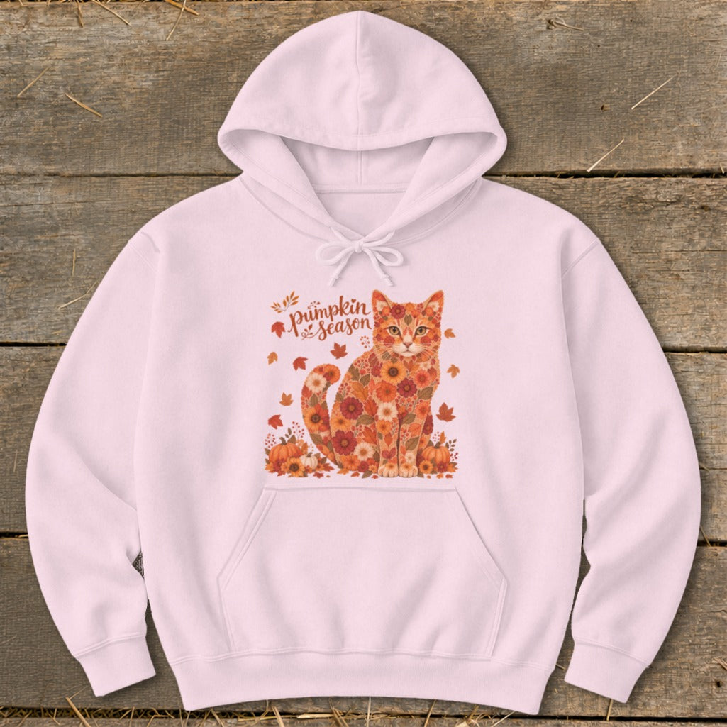 Pink hoodie with a cat graphic composed of floral patterns and the text "pumpkin season."