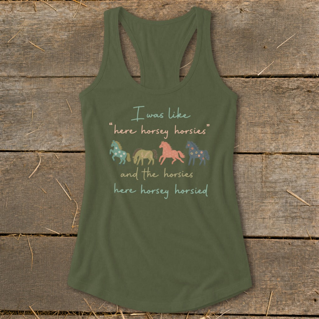 Green tank top with text and four colorful horses.