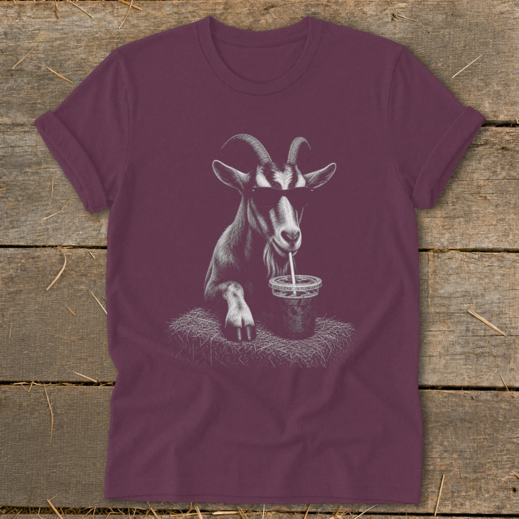 Maroon t-shirt with a graphic of a goat wearing sunglasses drinking from a cup.