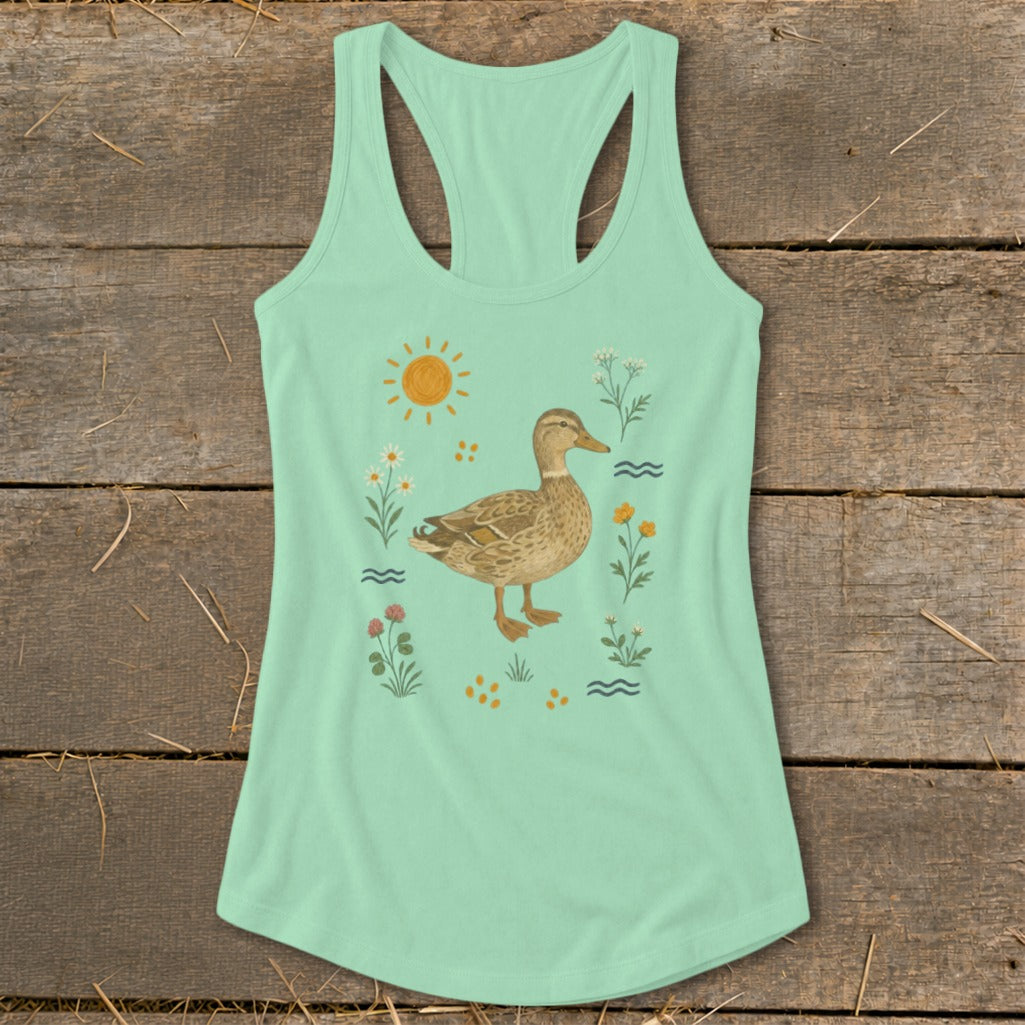 Mint green tank top with a central duck illustration surrounded by wildflowers and a sun.