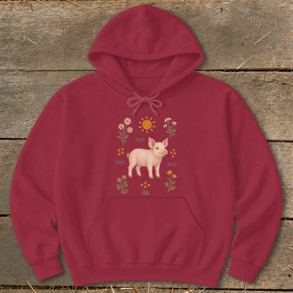 Maroon hoodie with a printed design of a piglet surrounded by flowers and a sun.