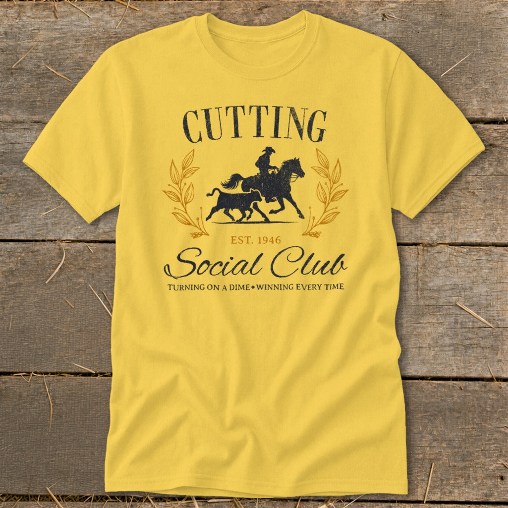 Yellow t-shirt with "Cutting Social Club" graphic featuring a cowboy on a horse and a bull.