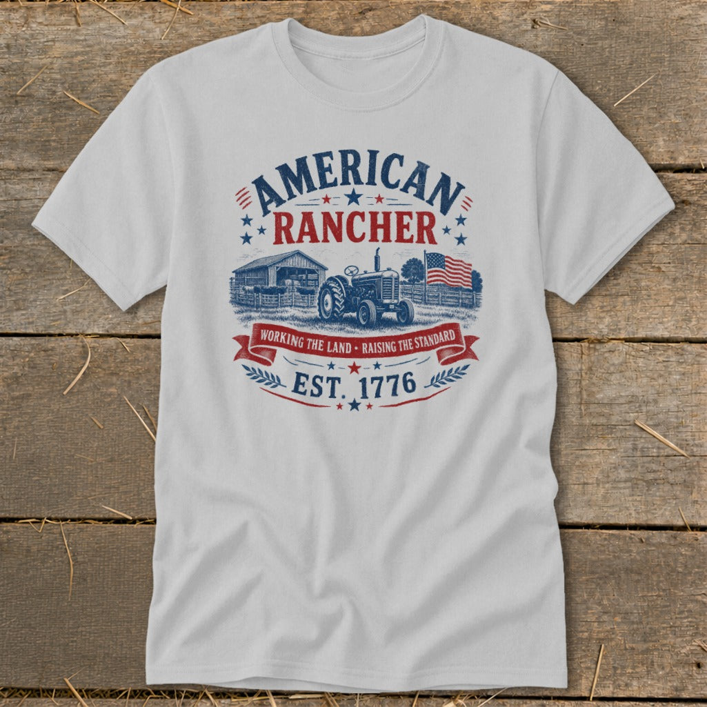 White t-shirt with "American Rancher Est. 1776" graphic featuring a tractor and farm.