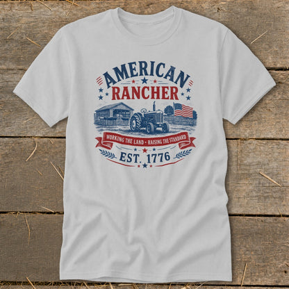 White t-shirt with "American Rancher Est. 1776" graphic featuring a tractor and farm.