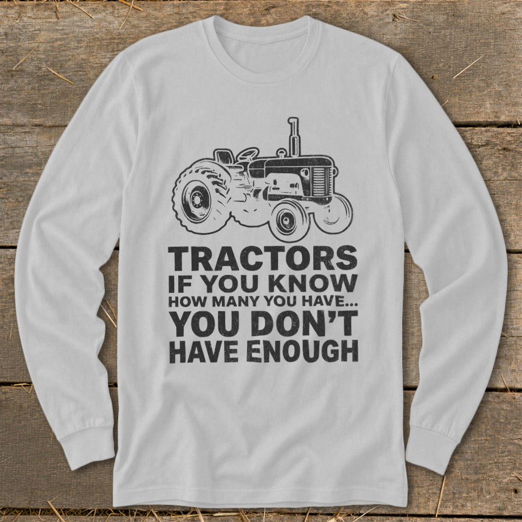 Long sleeve shirt with tractor graphic and text: "Tractors if you know how many you have... you don't have enough."
