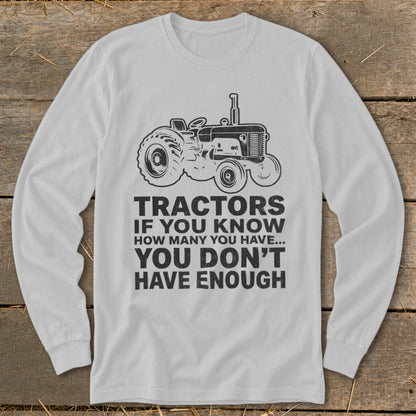 Long sleeve shirt with tractor graphic and text: "Tractors if you know how many you have... you don't have enough."