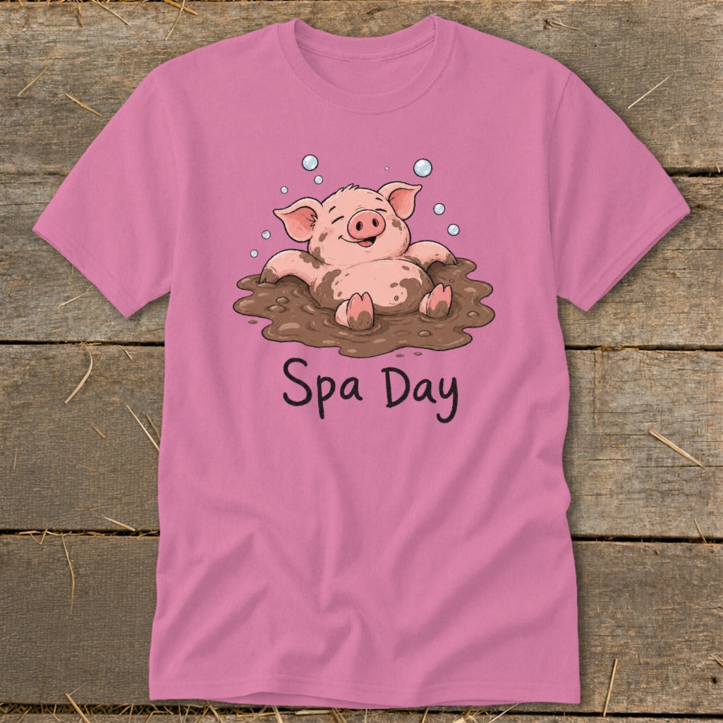 Pink t-shirt with a cartoon pig enjoying a mud bath, text reads "Spa Day".