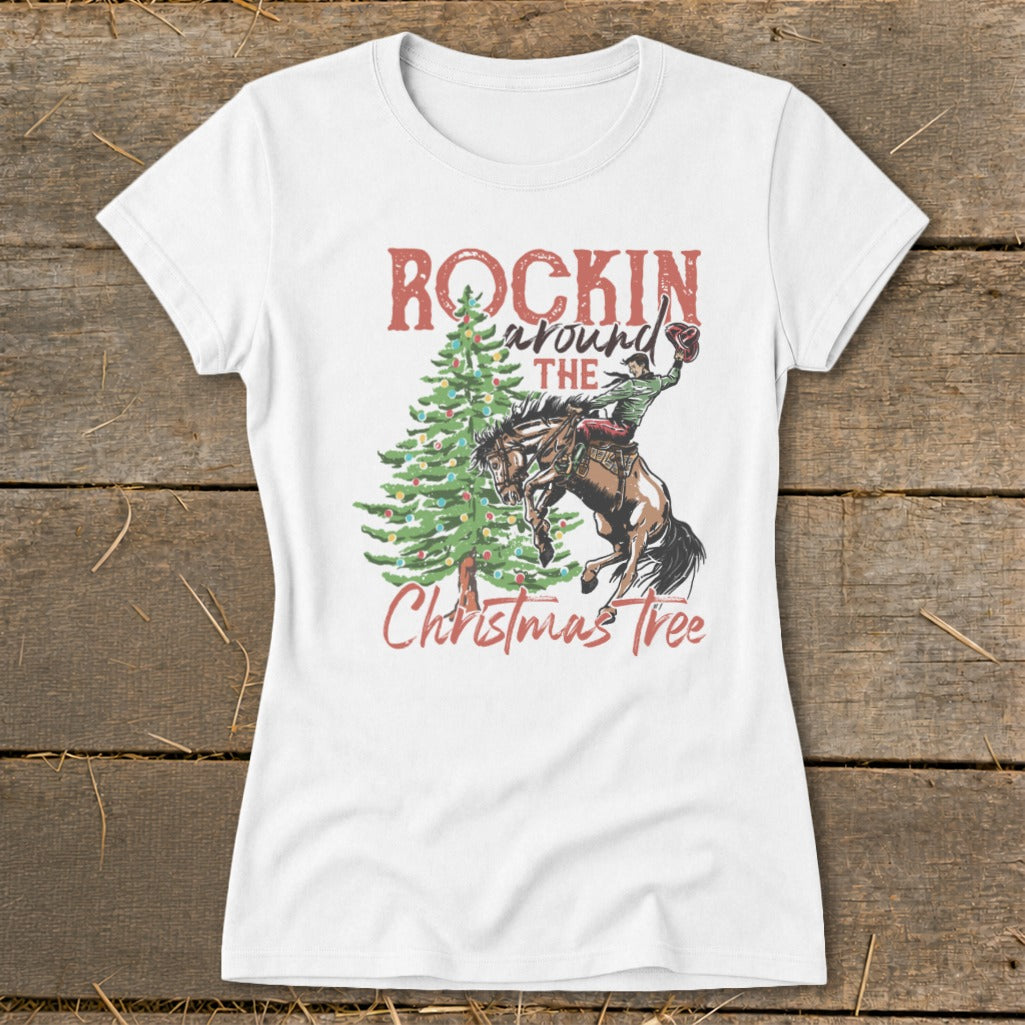 White t-shirt with a Christmas tree, bucking bronco, and "Rockin' Around The Christmas Tree" text.
