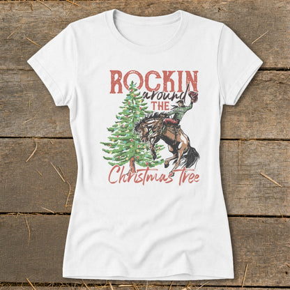 White t-shirt with a Christmas tree, bucking bronco, and "Rockin' Around The Christmas Tree" text.
