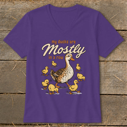 Purple t-shirt with "my ducks are Mostly in a row" and illustration of ducks.