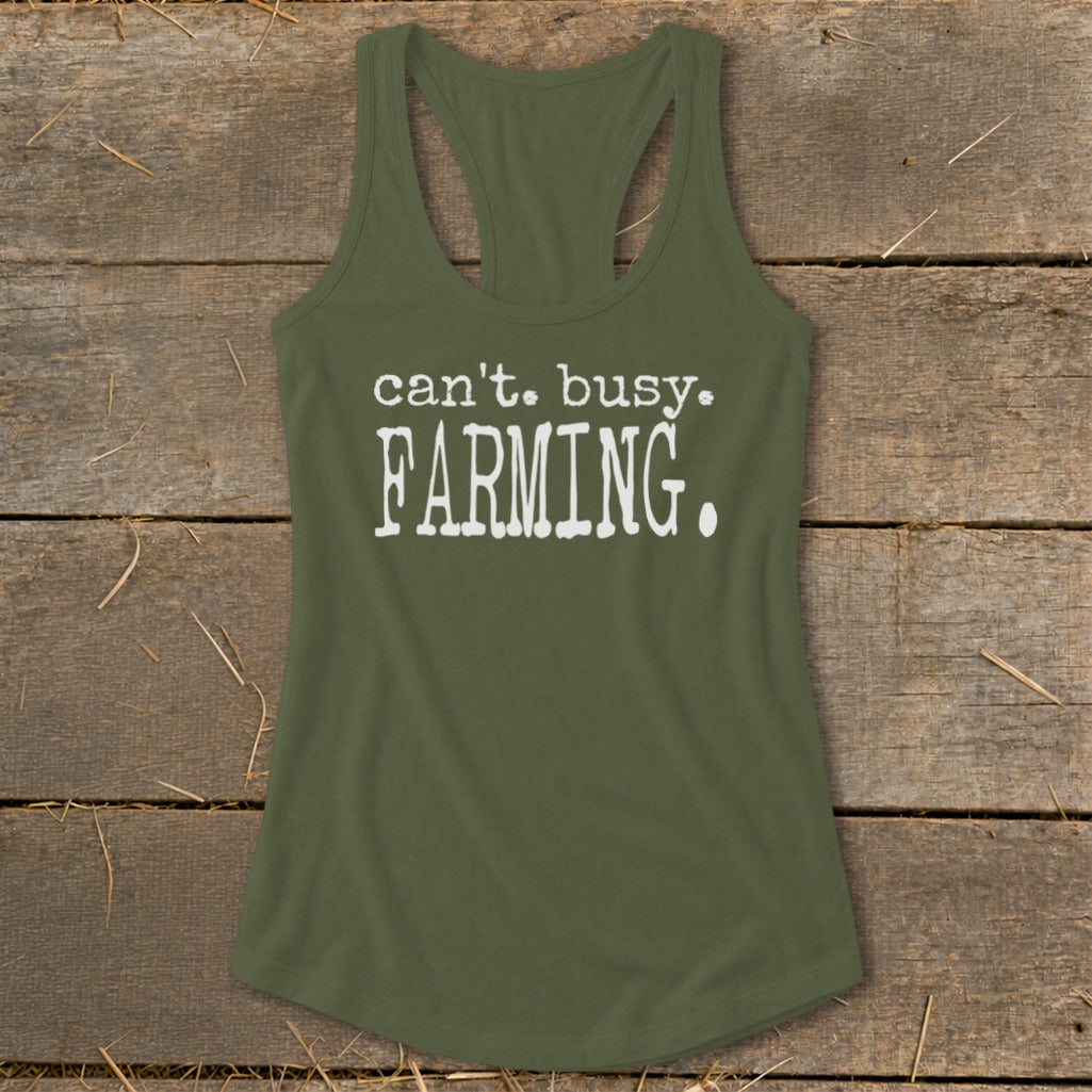 Olive green racerback tank top with white text reading "can't. busy. FARMING."