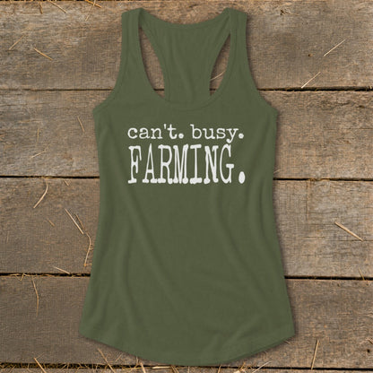 Olive green racerback tank top with white text reading "can't. busy. FARMING."