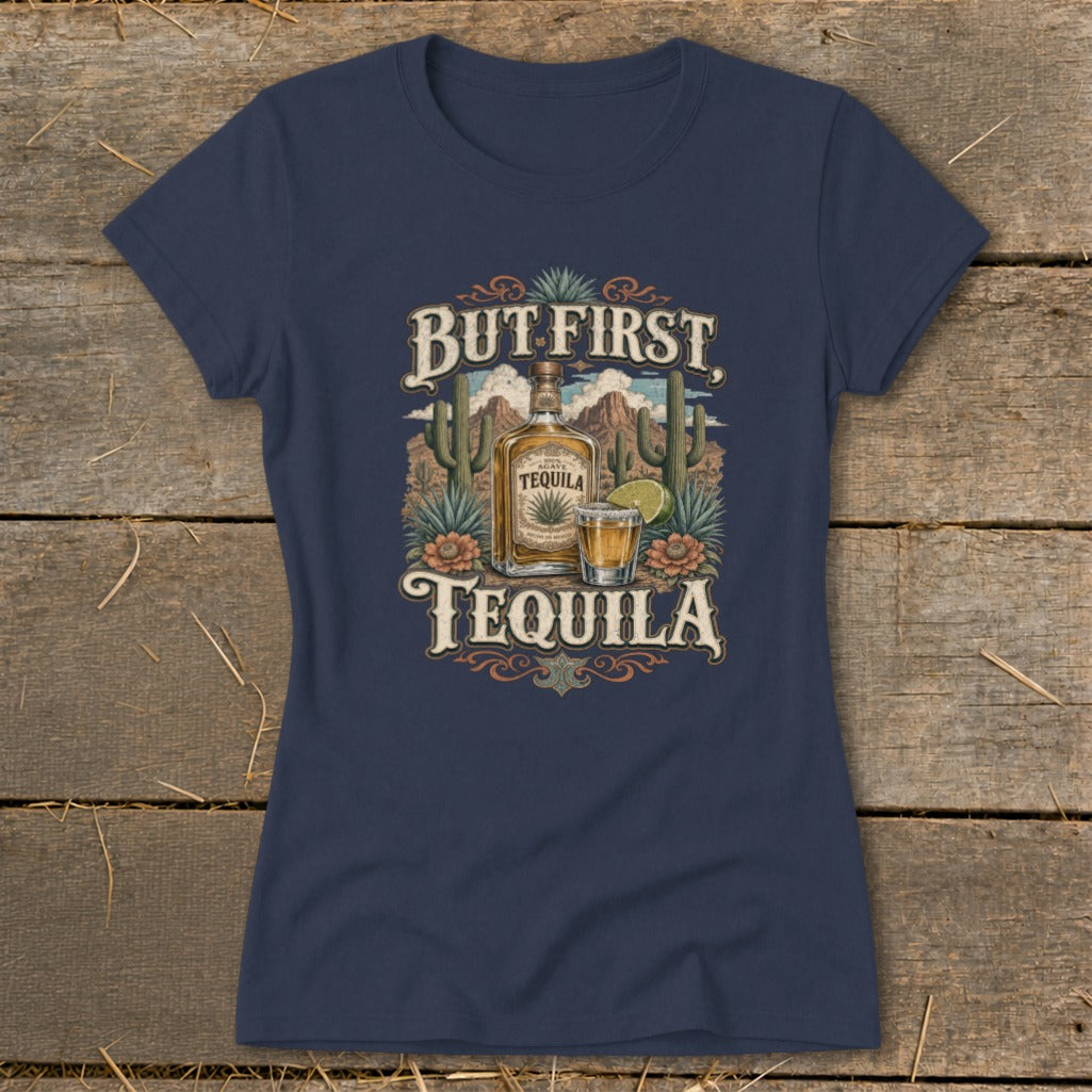 Navy t-shirt with "But First, Tequila" text and tequila bottle illustration.