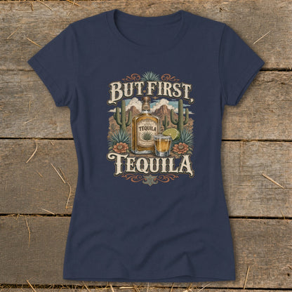 Navy t-shirt with "But First, Tequila" text and tequila bottle illustration.