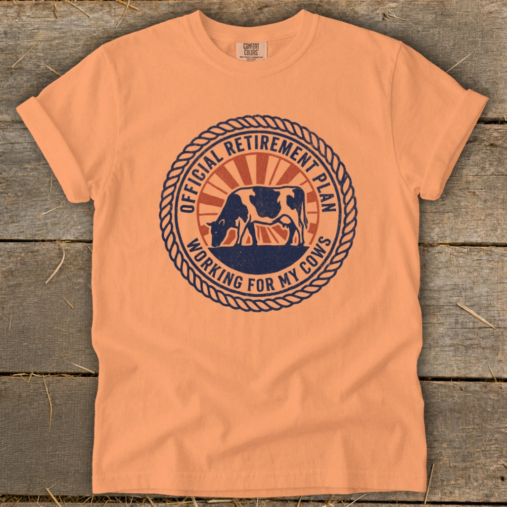 Peach t-shirt with "Official Retirement Plan Working For My Cows" graphic.