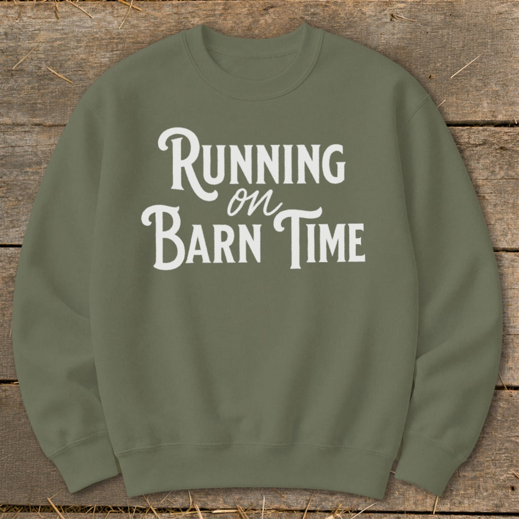 Olive green sweatshirt with "Running on Barn Time" in white distressed lettering.