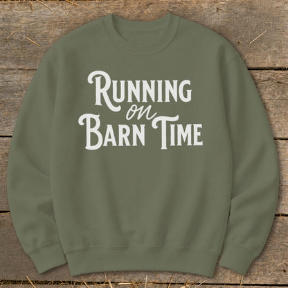 Olive green sweatshirt with "Running on Barn Time" in white distressed lettering.