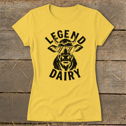 Yellow t-shirt with black graphic of a cow wearing sunglasses and text "LEGEND DAIRY".