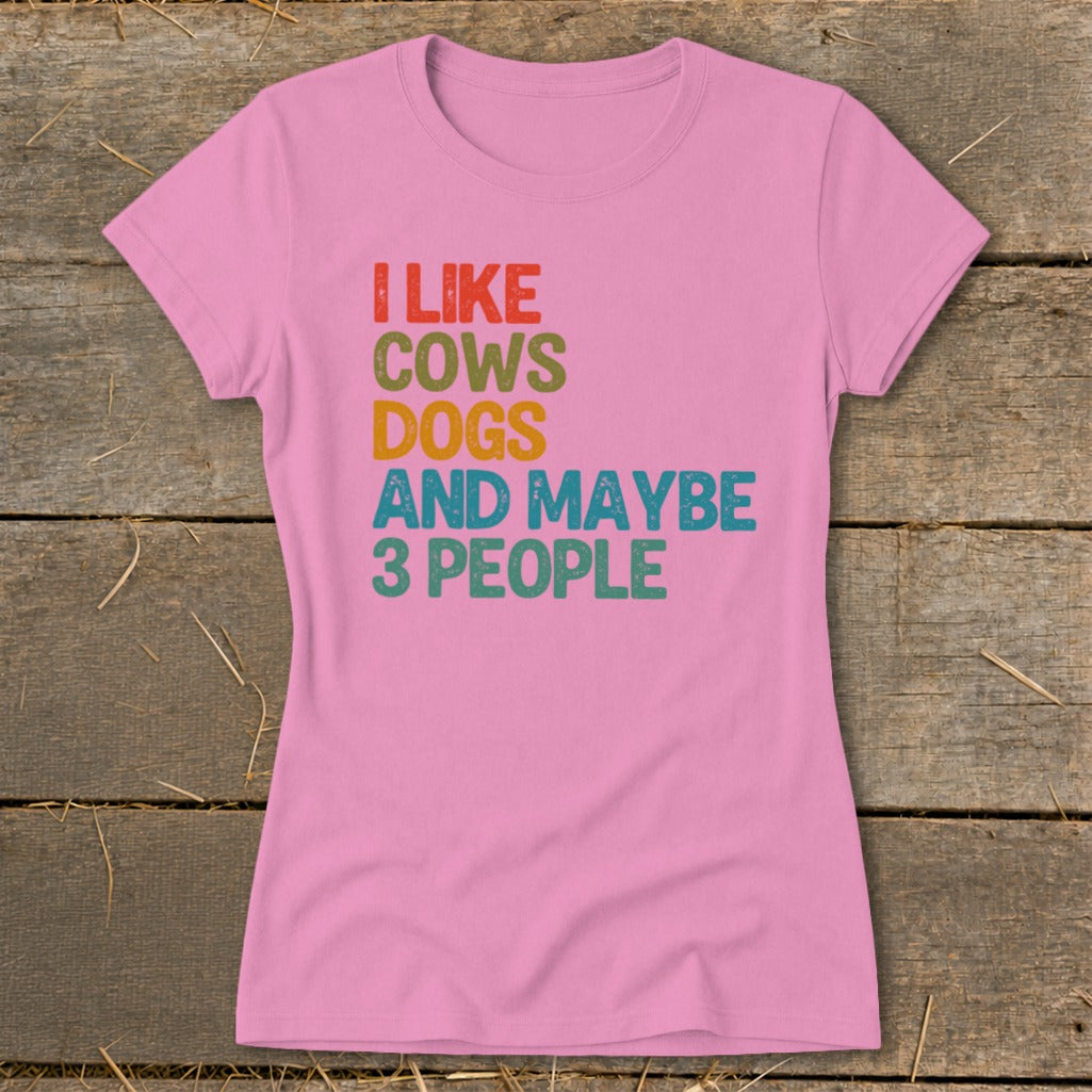 Pink t-shirt with "I Like Cows Dogs And Maybe 3 People" text.