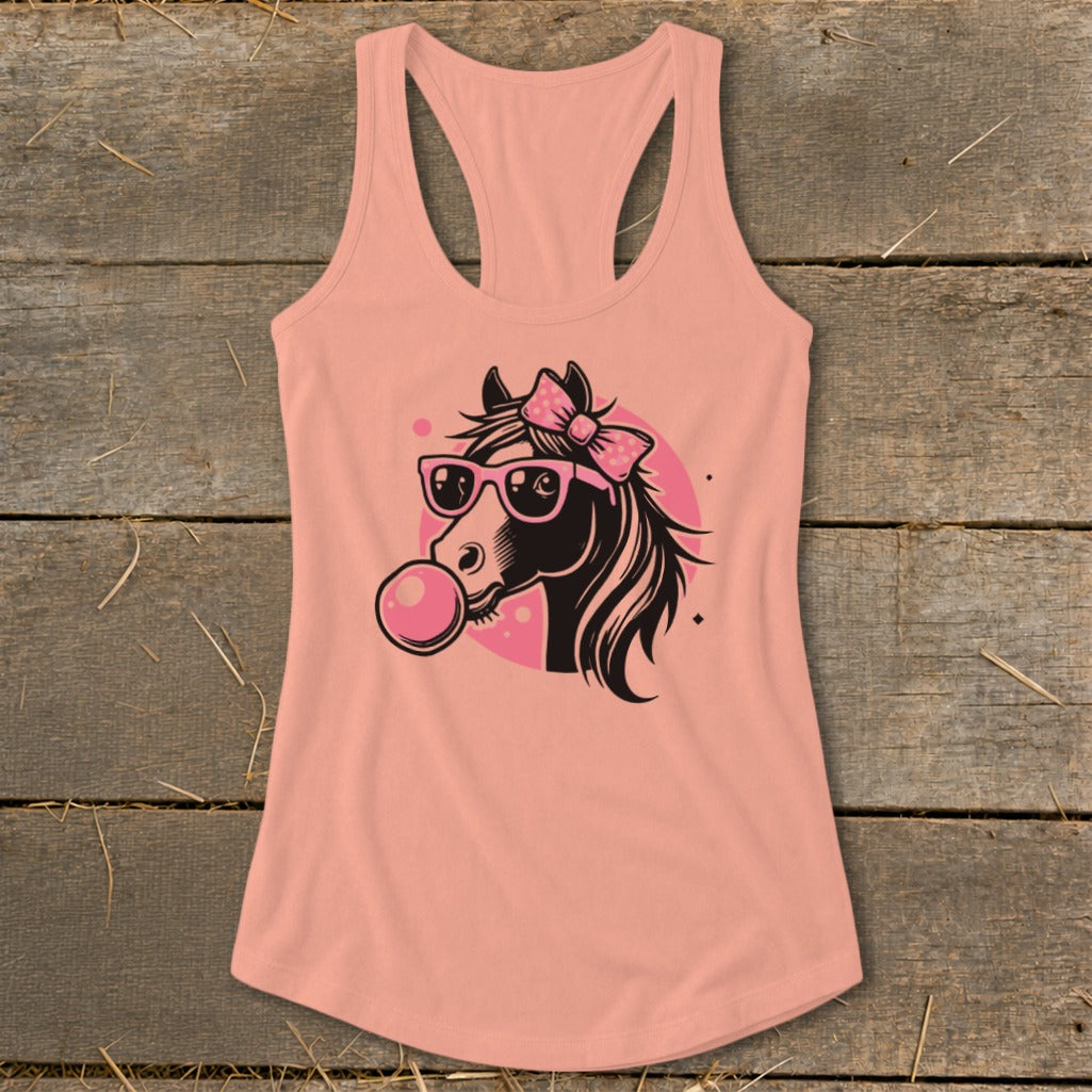 Horse graphic with pink bow, sunglasses, and bubble gum on peach tank top.